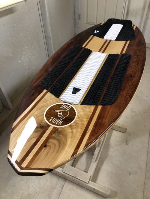 wood wakesurf board with black and white padding